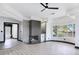 Stylish living room with fireplace and an archway leading into a bathroom at 8112 Golfers Oasis Dr, Las Vegas, NV 89149