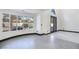 Spacious living area with large windows showcasing the backyard patio and landscape at 8112 Golfers Oasis Dr, Las Vegas, NV 89149