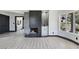 Bright living room with fireplace, wet bar, and windows at 8112 Golfers Oasis Dr, Las Vegas, NV 89149
