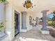Covered patio with pillars and tiled floor at 8112 Golfers Oasis Dr, Las Vegas, NV 89149
