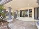 Covered patio with pillars and a view of the street at 8112 Golfers Oasis Dr, Las Vegas, NV 89149