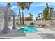Tranquil pool and beautifully landscaped backyard creates an ideal outdoor oasis at 8112 Golfers Oasis Dr, Las Vegas, NV 89149