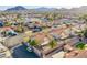 Aerial neighborhood view showcasing desert landscaping, terracotta roofs, and mountain views in the distance at 819 Teal Wing Way, Henderson, NV 89002
