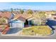 Charming single-story home featuring a well-maintained lawn, desert landscaping, and a two-car garage at 819 Teal Wing Way, Henderson, NV 89002