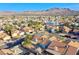 Expansive aerial neighborhood view showcasing mountain views and terracotta tile roofs at 819 Teal Wing Way, Henderson, NV 89002