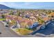 Neighborhood aerial view showing a single-story home with a terracotta roof and mountain views at 819 Teal Wing Way, Henderson, NV 89002