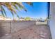 Fenced backyard with desert landscaping, a block wall and some palm trees visible at 819 Teal Wing Way, Henderson, NV 89002