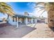Enclosed patio with white posts, a small overhang, and an adjacent desert landscape at 819 Teal Wing Way, Henderson, NV 89002