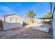 Backyard featuring shed, desert landscaping, a palm tree, and a covered patio at 819 Teal Wing Way, Henderson, NV 89002