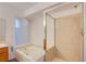 Bright bathroom features a soaking tub and a separate shower at 819 Teal Wing Way, Henderson, NV 89002