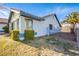 Charming single-story home featuring a well-maintained lawn, desert landscaping, and a gated side yard at 819 Teal Wing Way, Henderson, NV 89002