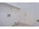 Laundry room with tile flooring, shelving, and washer/dryer hookups at 819 Teal Wing Way, Henderson, NV 89002