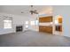 A bright living room with a fireplace and views to the kitchen and dining area at 819 Teal Wing Way, Henderson, NV 89002