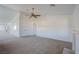 Inviting living room with neutral carpet, light walls, and large entryway at 819 Teal Wing Way, Henderson, NV 89002