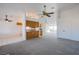 Spacious living space featuring carpeted floors and view into dining room and kitchen at 819 Teal Wing Way, Henderson, NV 89002