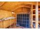 Inside of the shed with exposed wood beams, shelving, and various stored items at 819 Teal Wing Way, Henderson, NV 89002