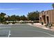 Outdoor basketball court with a hoop, surrounded by landscaping and park benches at 8301 Strawberry Spring St, Las Vegas, NV 89143