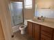 Functional bathroom with a shower, vanity, and tiled floor, practical and clean at 8301 Strawberry Spring St, Las Vegas, NV 89143