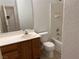 Bathroom featuring vanity and tub/shower combo with tile at 8301 Strawberry Spring St, Las Vegas, NV 89143
