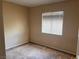 Neat bedroom with carpet flooring and a window, offering comfort and simplicity at 8301 Strawberry Spring St, Las Vegas, NV 89143