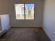 Bedroom featuring a window and neutral carpeting at 8301 Strawberry Spring St, Las Vegas, NV 89143