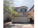 Charming two-story home features a well-maintained lawn and attached two-car garage at 8301 Strawberry Spring St, Las Vegas, NV 89143