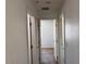 Hallway with doors leading to carpeted bedrooms at 8301 Strawberry Spring St, Las Vegas, NV 89143