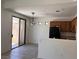 Open kitchen and dining area featuring modern appliances and direct access to the outdoor patio at 8301 Strawberry Spring St, Las Vegas, NV 89143