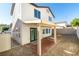 Backyard showcases a covered patio, low-maintenance gravel landscaping, and convenient rear door access at 9092 Sosa Creek Ave, Las Vegas, NV 89149