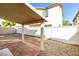 Backyard boasts a covered patio area with tiled floor and an expansive gravel yard space at 9092 Sosa Creek Ave, Las Vegas, NV 89149