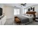 Modern bedroom featuring a plush bed, soft carpet, and minimalist decor at 9092 Sosa Creek Ave, Las Vegas, NV 89149