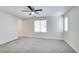 Bright bedroom with neutral carpet, a ceiling fan, and multiple windows offering plenty of natural light at 9092 Sosa Creek Ave, Las Vegas, NV 89149