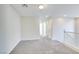 Upstairs hallway with neutral carpet and white trim, leading to the bedrooms at 9092 Sosa Creek Ave, Las Vegas, NV 89149