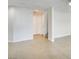 Open-concept living room with tile flooring and access to the stairs at 9092 Sosa Creek Ave, Las Vegas, NV 89149