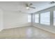 The open concept living room features large windows offering lots of natural light at 9092 Sosa Creek Ave, Las Vegas, NV 89149