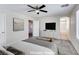 This main bedroom features neutral walls, a ceiling fan, and plush gray carpeting at 9092 Sosa Creek Ave, Las Vegas, NV 89149