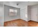 Cozy bedroom with wood-look floors, closet and a bright window allowing natural light at 9177 Bucksprings Dr, Las Vegas, NV 89129