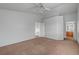 Neutral bedroom featuring neutral walls, ceiling fan, and adjoined bathroom at 9177 Bucksprings Dr, Las Vegas, NV 89129