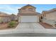 Charming two-story home with a two-car garage and desert landscaping at 9177 Bucksprings Dr, Las Vegas, NV 89129