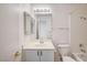 Bathroom featuring a vanity, mirror, and tiled shower with tub combination at , Las Vegas, NV 89130