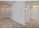 Open hallway features neutral tile flooring, storage closet, and entry to the front door at , Las Vegas, NV 89130