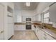 Modern kitchen with white cabinets, granite countertops, and stainless appliances at , Las Vegas, NV 89130