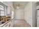 Bright kitchen eat-in area with tile floors, ceiling fan, and outdoor view at , Las Vegas, NV 89130