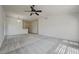 Spacious carpeted living room with ample natural light from the multiple large windows at , Las Vegas, NV 89130