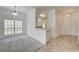Spacious living room featuring large window, adjacent breakfast bar, and neutral carpet at , Las Vegas, NV 89130