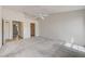 Generously sized main bedroom with neutral carpet, ceiling fan, and ensuite bathroom and closet access at , Las Vegas, NV 89130