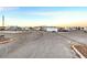 Wide shot of paved parking lot with various RVs and trailers parked on the lot, and blue sky at , Las Vegas, NV 89130