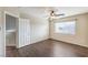 Bedroom with wood-look flooring, window, and doorway at 10199 Rising Tree St, Las Vegas, NV 89183