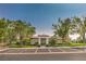 Exterior of clubhouse with parking and desert landscaping at 10205 Birch Bluff Ln, Las Vegas, NV 89145