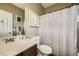 Bathroom featuring modern fixtures, a toilet, and a shower with a decorative curtain at 12277 Bluebird Canyon Pl, Las Vegas, NV 89138
